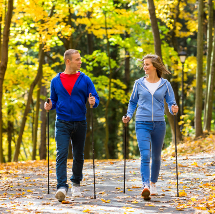 Nordic walking - active people working out outdoor