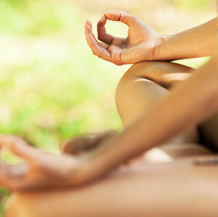 Young female meditate in nature.Close-up image.