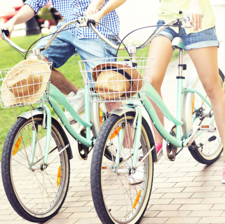 Couple riding bikes in the park