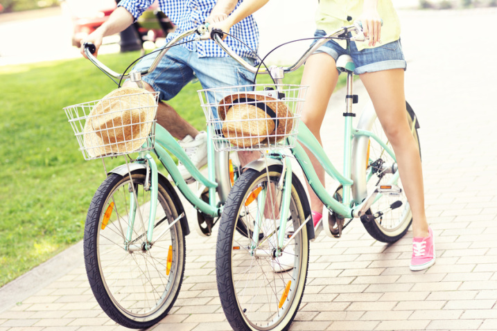 Couple riding bikes in the park