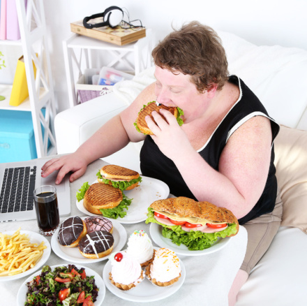 Fat man has a big lunch and playing games