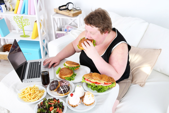 Fat man has a big lunch and playing games